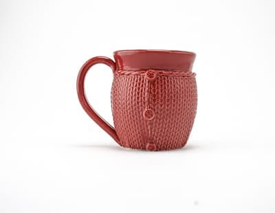 Red knitted sweater mug